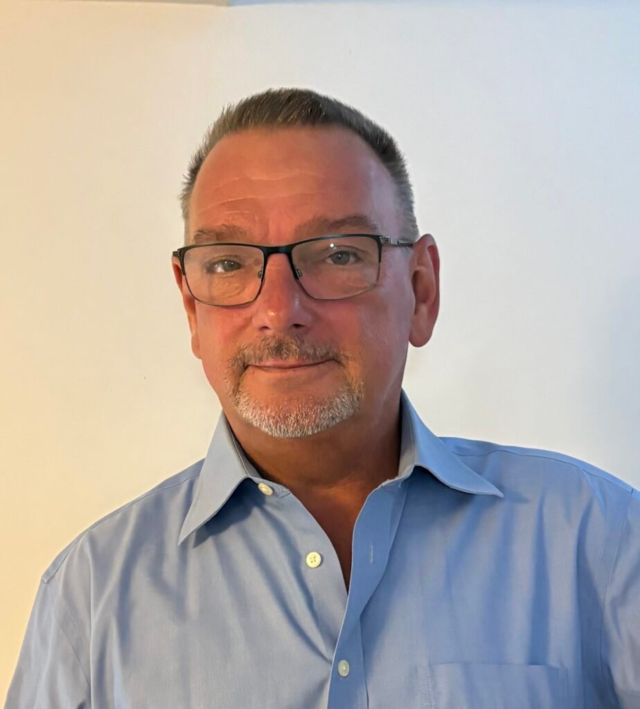 Head and shoulders portrait of Bill Jukes in a light blue shirt