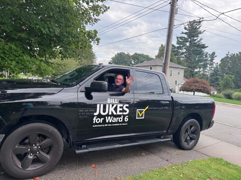 Bill Jukes waving from his truck marked Bill Jukes for Ward 6